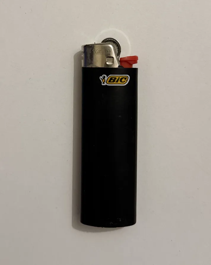 black bic lighter with red button